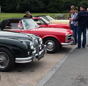 Corporate client event classic car selection and guests
